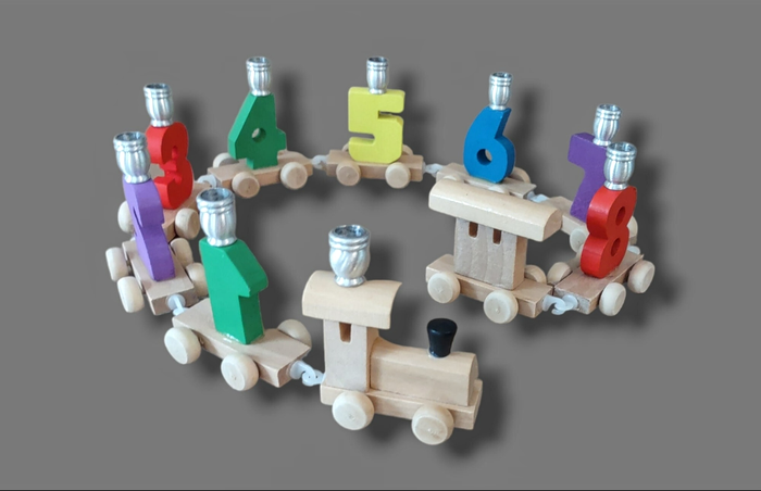 Chanukah Express menorah — linked wooden toy train cars holding candle cups | Judaica Square Lakewood