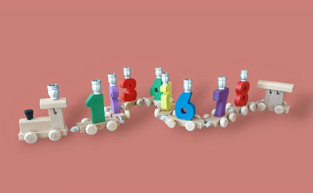 Chanukah Express menorah — linked wooden toy train cars holding candle cups | Judaica Square Lakewood (view 2)