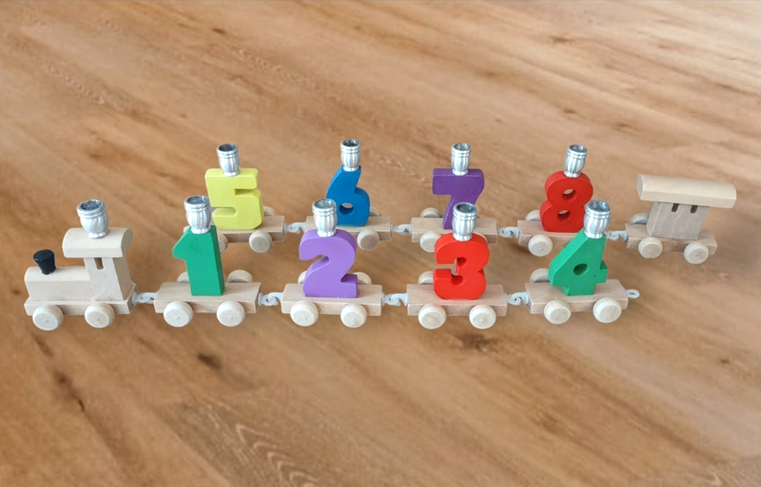 Chanukah Express menorah — linked wooden toy train cars holding candle cups | Judaica Square Lakewood (view 3)