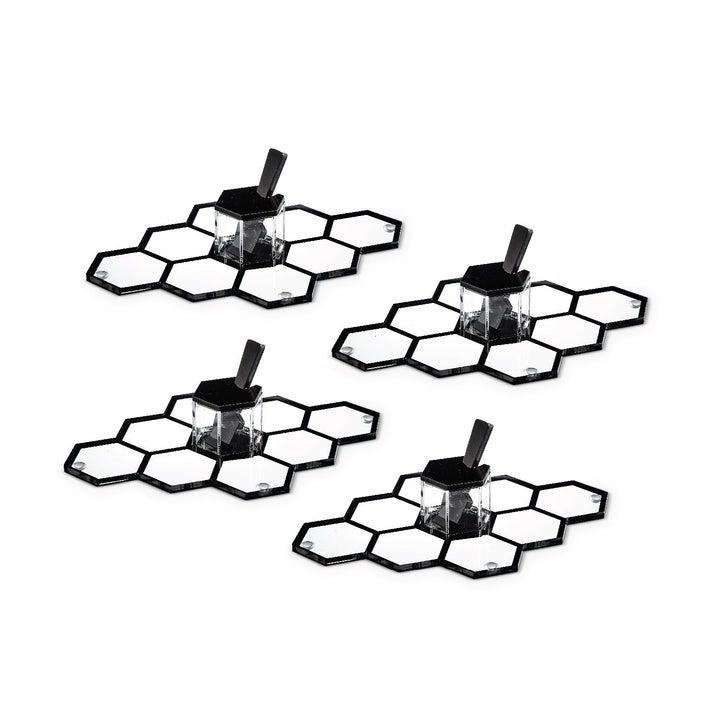 Four black personal honeycomb simanim trays, each with its mini honey dish