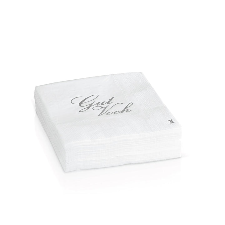 Stack of white paper napkins, the top one stamped Gut Voch in silver script