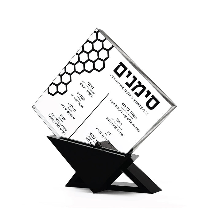 Honeycomb simanim card angled in its black lucite triangular base
