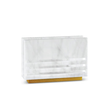White marble lucite napkin holder with laser-cut lines on a gold base, shown empty