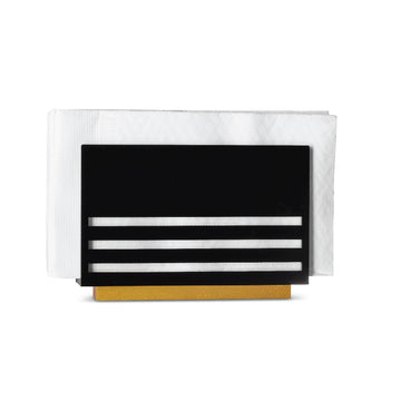 Black lucite triple line napkin holder filled with white napkins