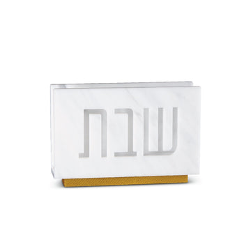 White marble lucite Shabbos napkin holder shown empty on its gold base