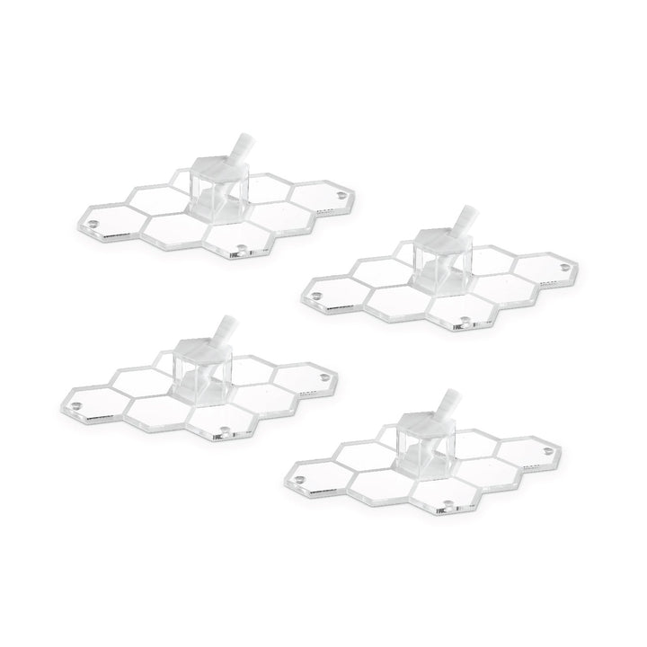 Four white personal honeycomb simanim trays, each with its mini honey dish