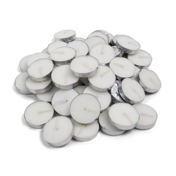 Pile of white tea light candles in aluminium cups, top view