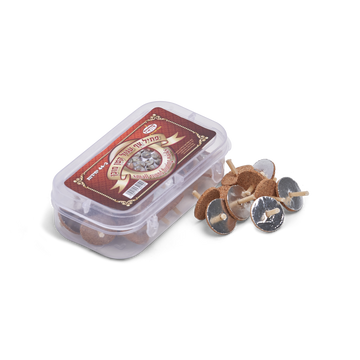 Clear plastic box of small round floating wicks with cork and foil discs spilled beside it