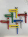 Assorted colorful wooden Purim graggers with small animal faces above their frames