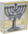 Boxed antique silver aluminum menorah with a Star of David set into a scrolled trunk