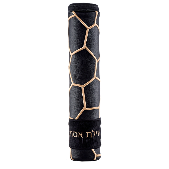Black cylindrical Megillah holder with gold-colored geometric lines and Hebrew lettering on a black fur band