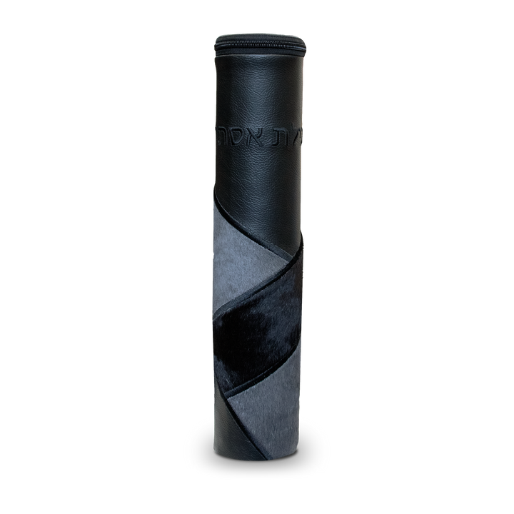 Black cylindrical Megillah holder with curved gray-and-black fur panels and black Hebrew lettering near the top