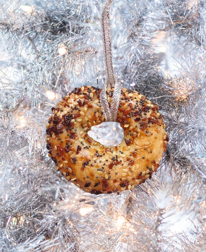 Real preserved everything bagel ornament hanging from a ribbon loop | Judaica Square Lakewood