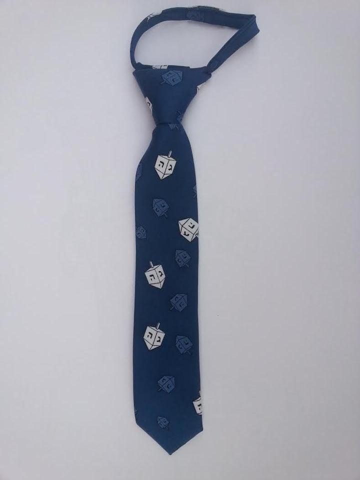 Blue kids Chanukah tie with white dreidels