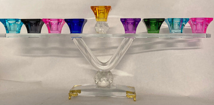 Crystal menorah with colored cups, a clear V stem and gold tone feet