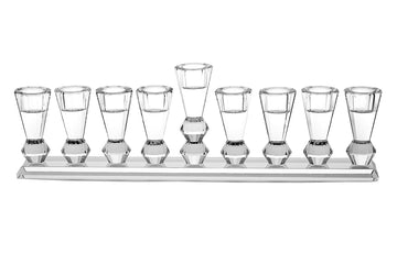 Clear crystal menorah with tall faceted cups on a flat base