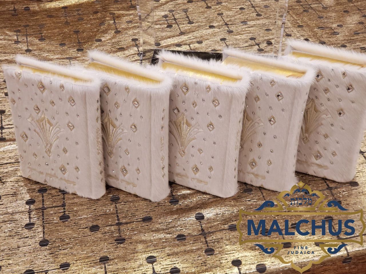 Detail view of custom machzorim matched to tallis and tefillin bags