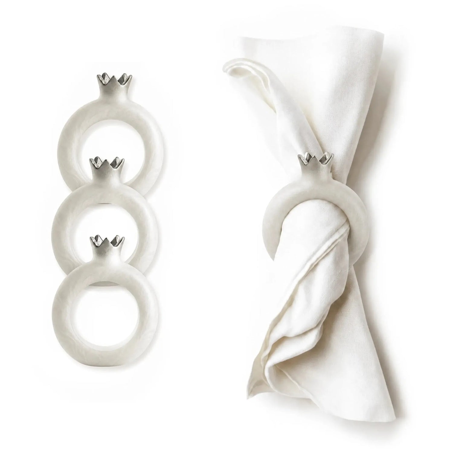 Deep red pomegranate napkin ring holding a folded cloth napkin