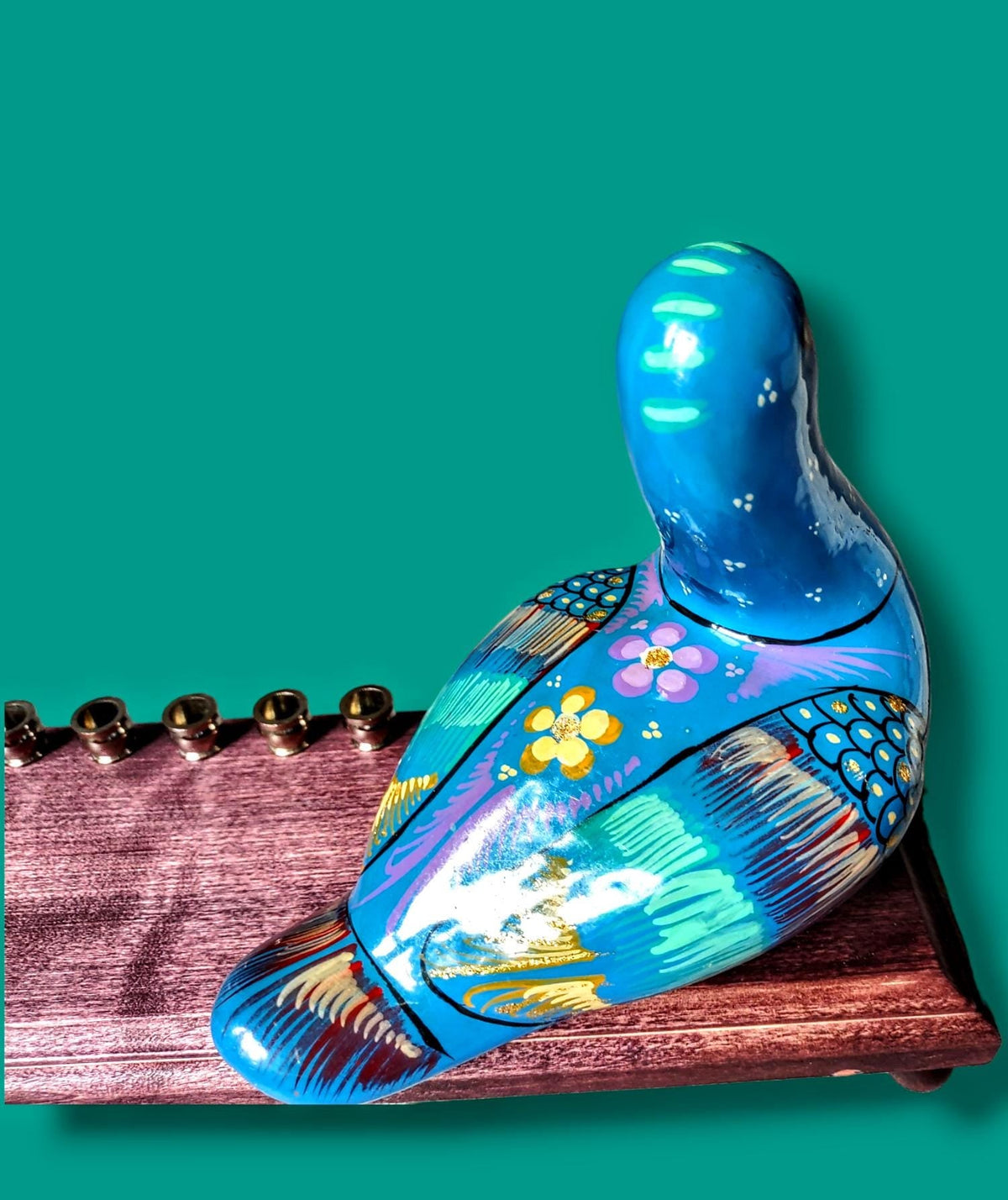 Blue Bird Menorah, close-up of the painted ceramic bird