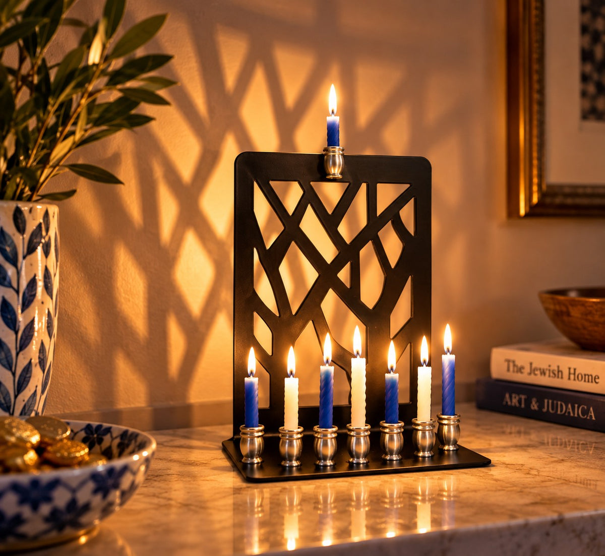 Branches menorah with all candles lit in a dim room