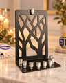 Branches of Light Menorah, black metal tree-branch menorah with silver candle cups