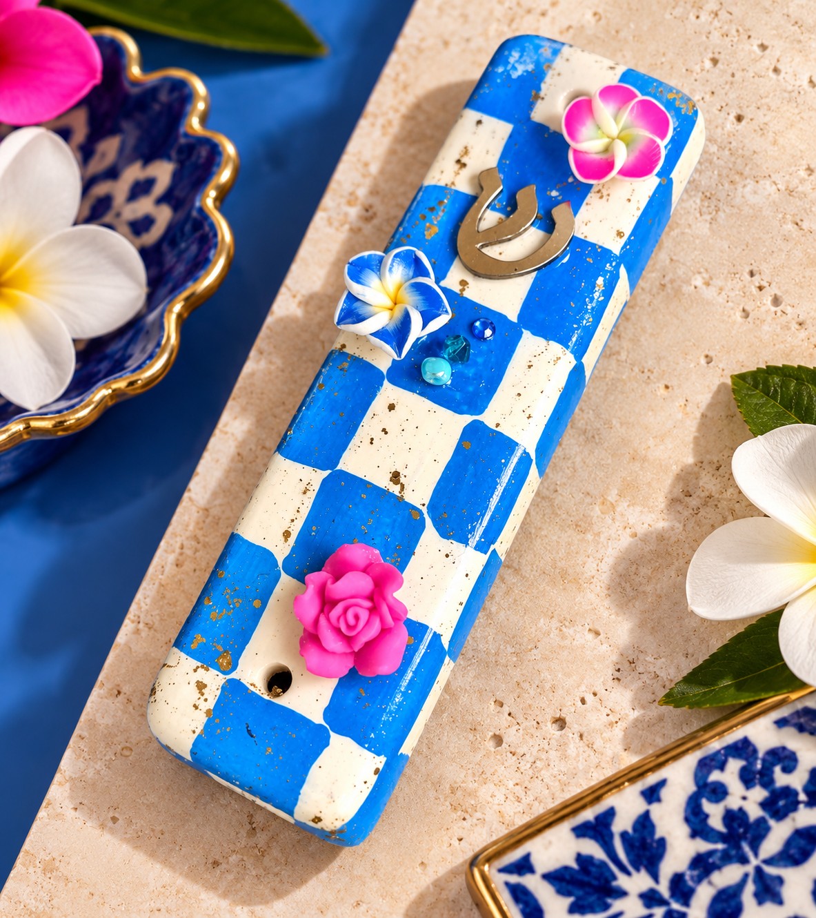 Checkered & Charmed Ceramic Mezuzah Collection, blue and white checkered mezuzah with pink flower