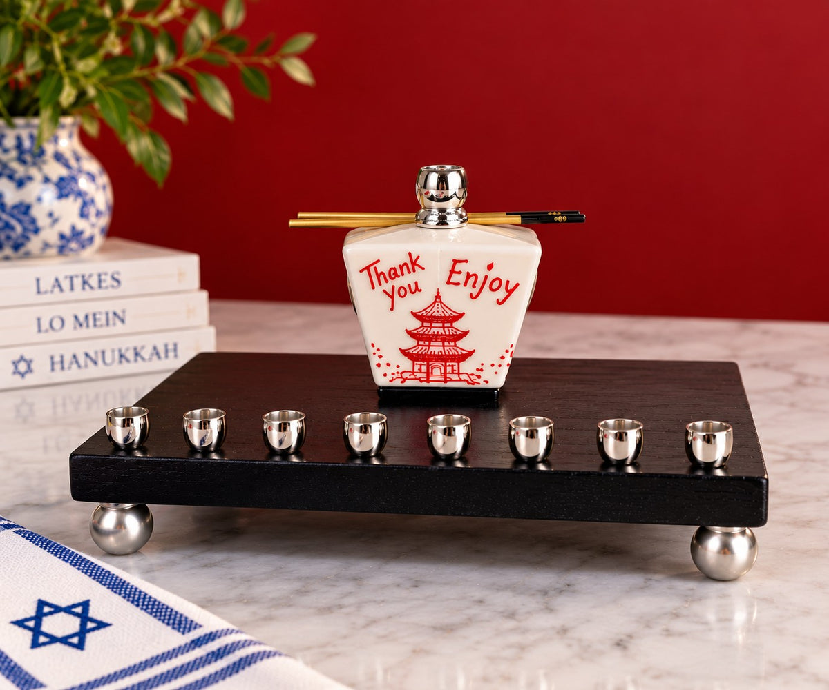 Takeout box menorah on a red backdrop
