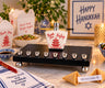Chinese takeout box shamash on a black menorah base