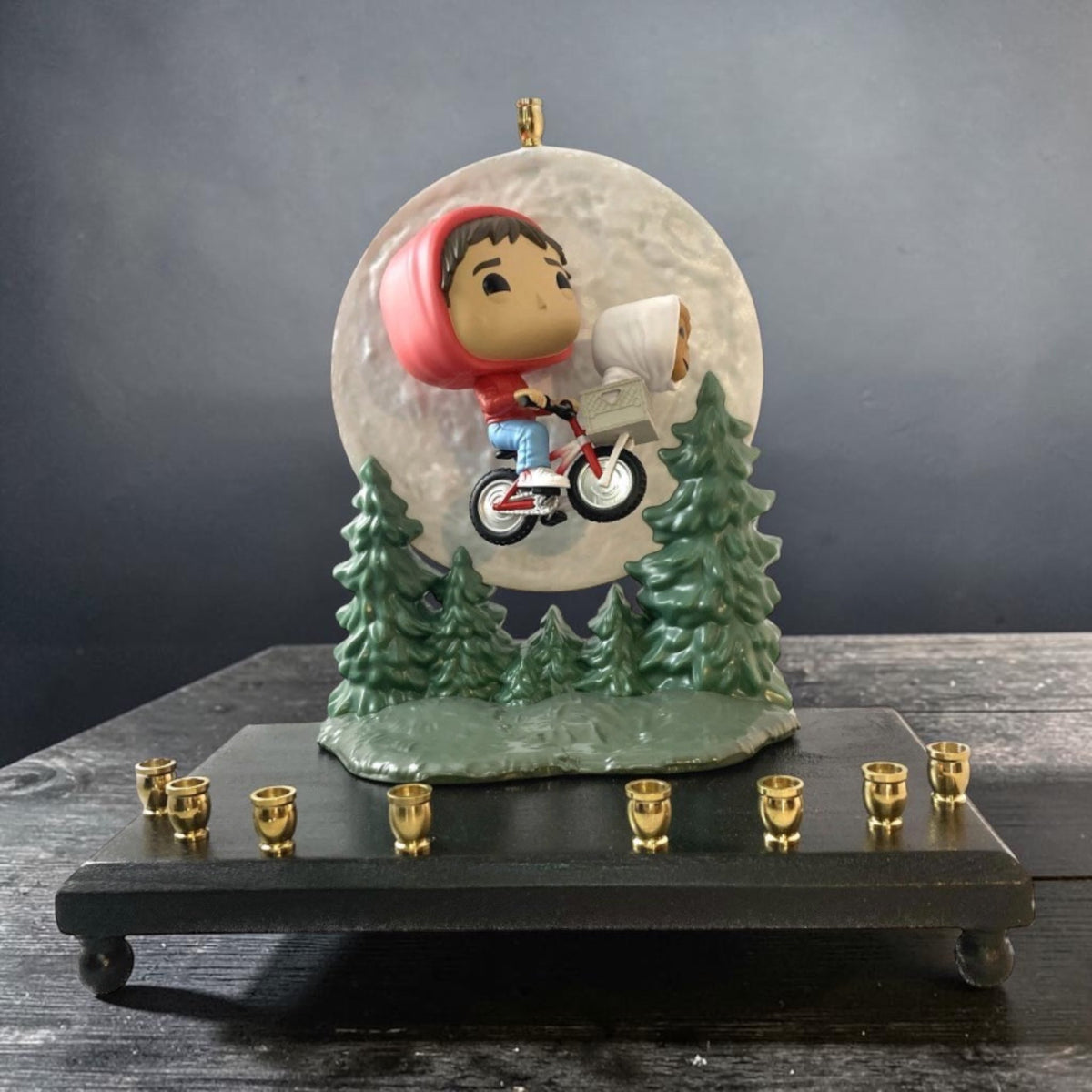E.T. and Elliott menorah on a dark table