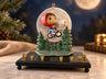 Collector’s E.T. & Elliott Menorah, E.T. and Elliott bike silhouette panel with trees on a black base