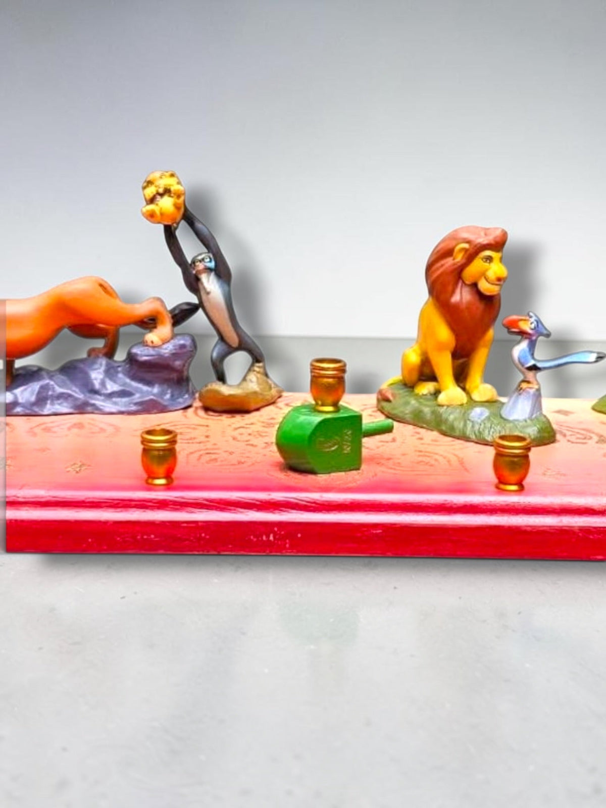 Collector’s Edition Lion King “Circle of Life” Menorah, side angle of the Circle of Life menorah showing the character…