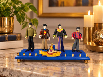 Collector’s Edition Yellow Submarine Menorah, four Beatles figures on a blue menorah base