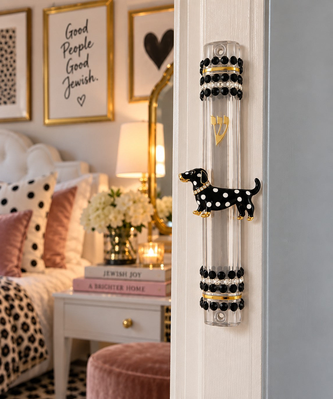 Clear mezuzah case with black polka-dot dachshund mounted on a doorpost