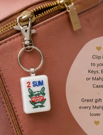 Mah Jong tile keychain on a pink bag
