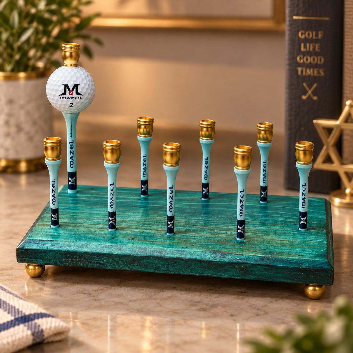 Golf menorah on a desk beside books and a plant