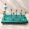 Golf Menorah, teal wood base with golf-tee candle holders and a golf ball shamash