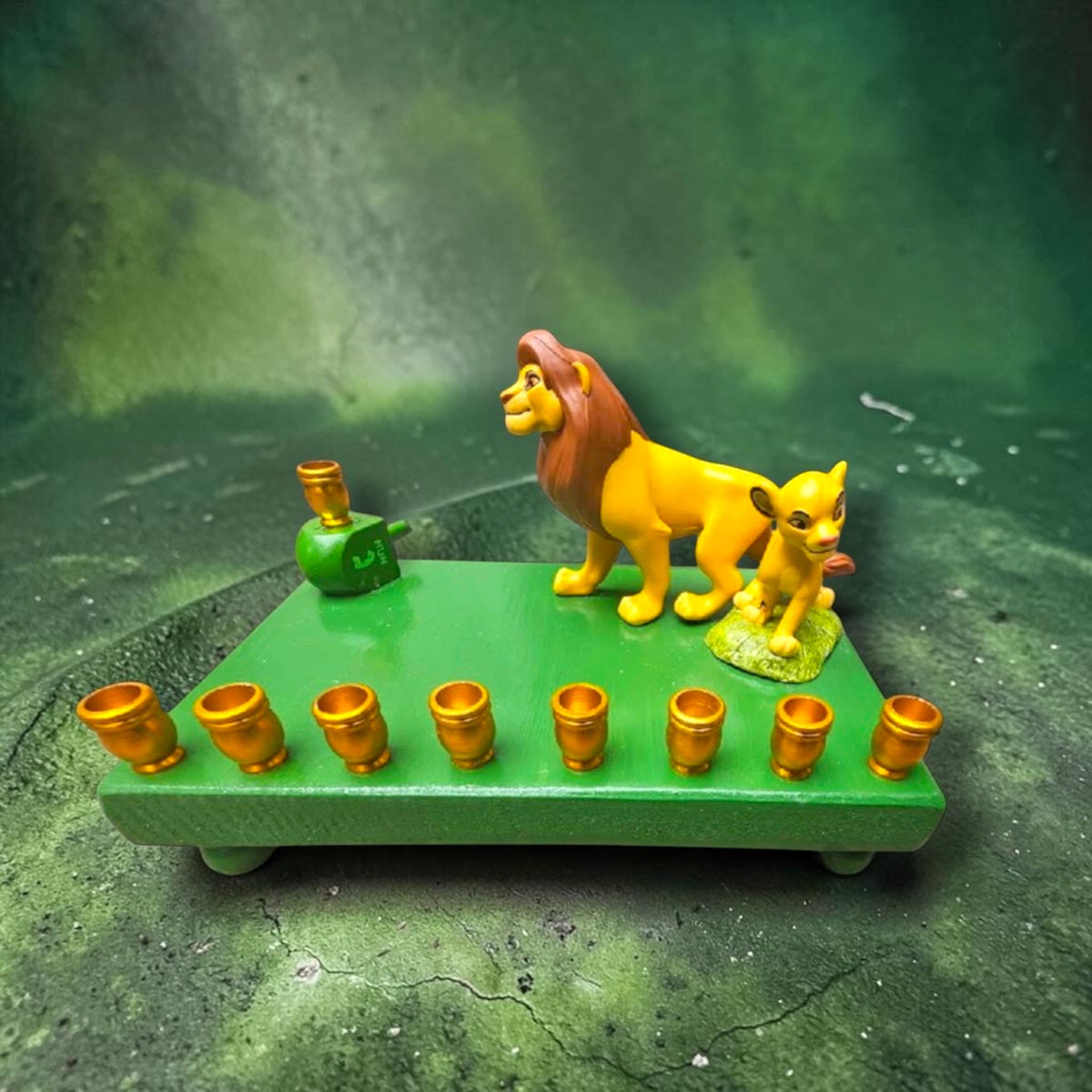 Lion King Simba & Mufasa Menorah, Simba and Mufasa figures on the green base against a dark jungle backdrop