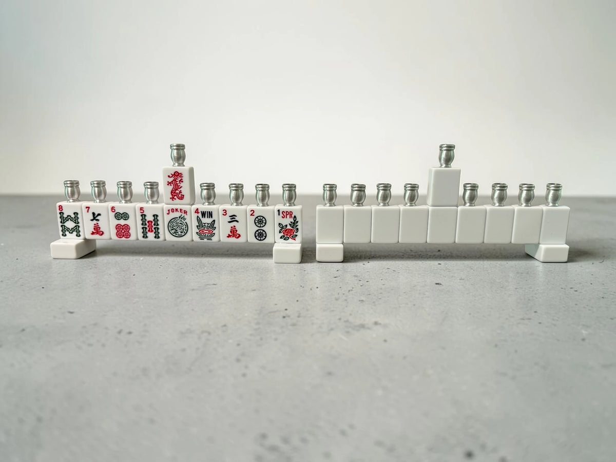 White mahjong tile menorah on a gray surface