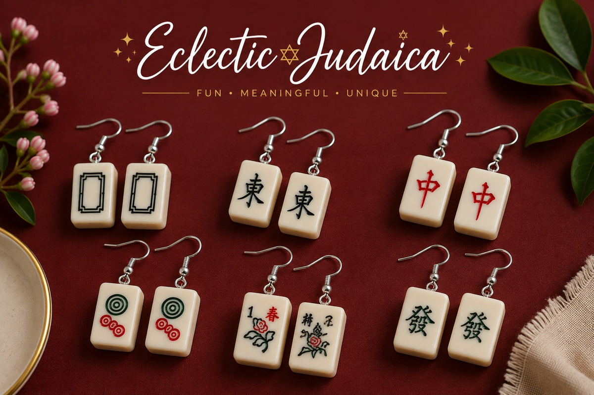Several pairs of mah jong tile earrings on red
