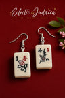 Mah jong tile earrings on a red card with the Eclectic Judaica logo