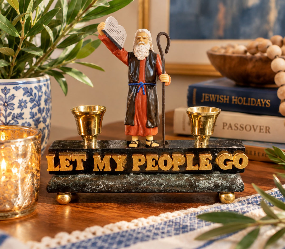 Moses Let My People Go candle holder on a Shabbat table