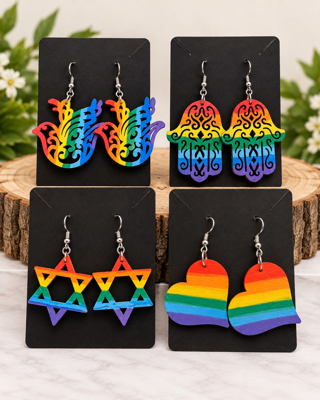 Rainbow earrings in hamsa, star, heart and wing shapes