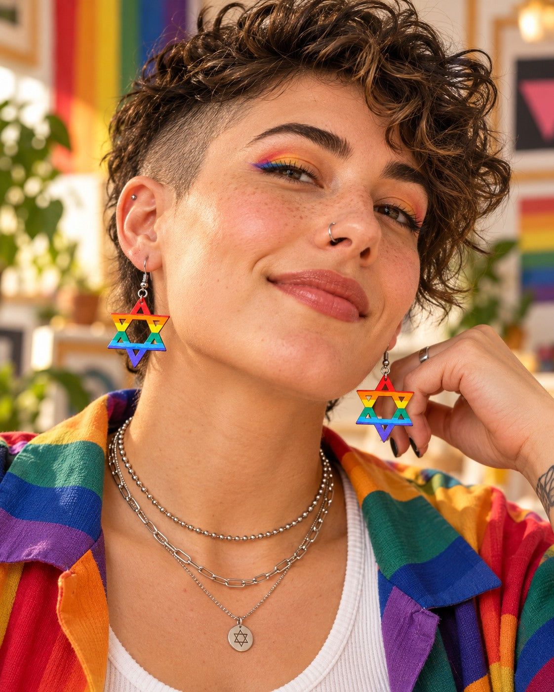 Model wearing the rainbow star earrings