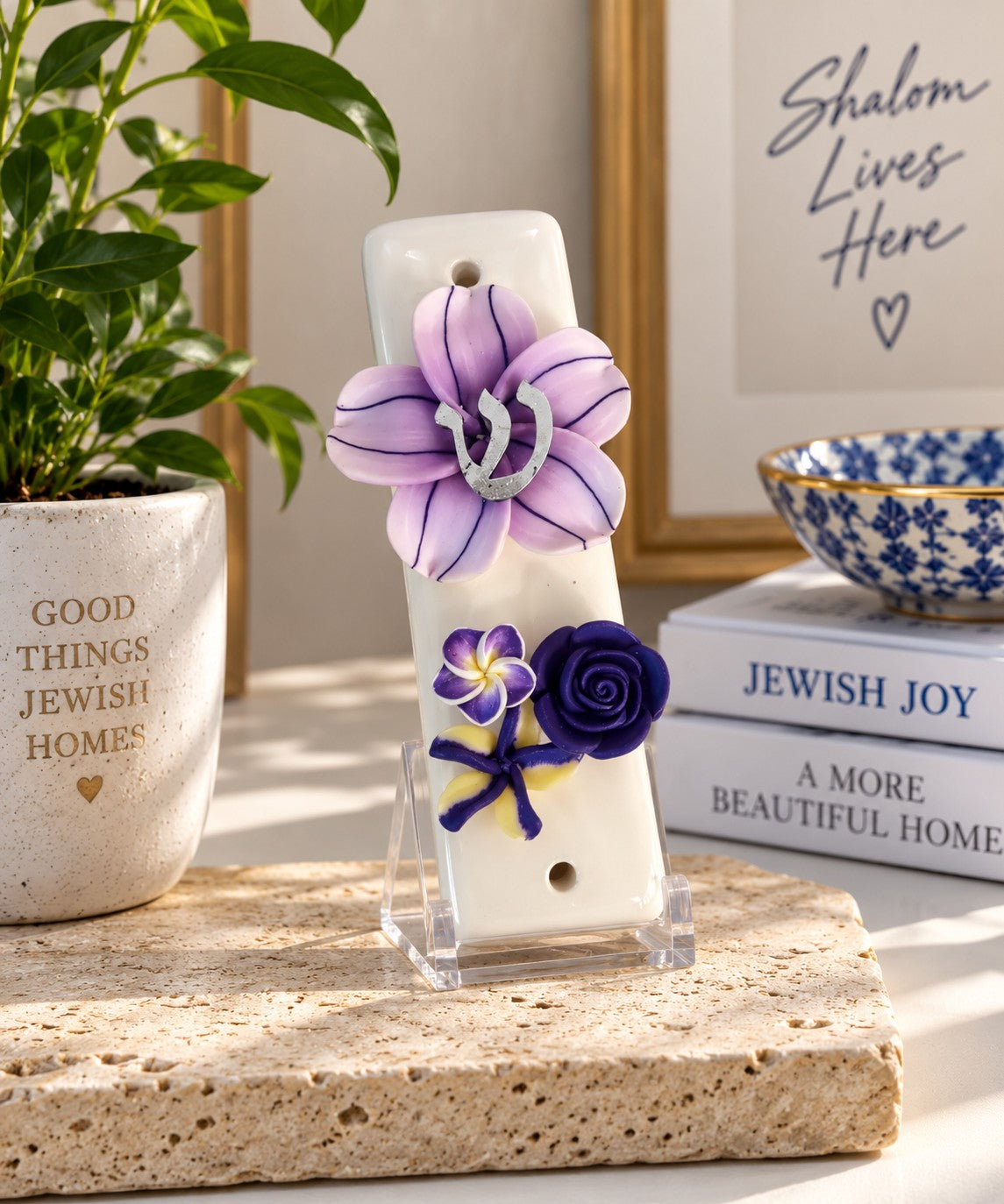 Shalom in Bloom Ceramic Mezuzah, lavender floral ceramic mezuzah on a shelf