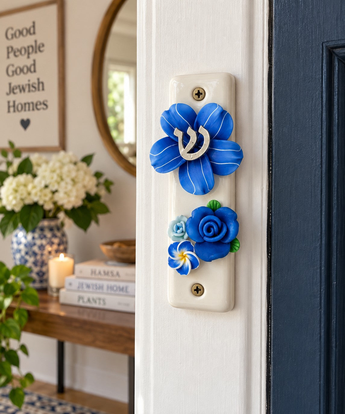 Shalom in Bloom Ceramic Mezuzah, blue floral ceramic mezuzah on a doorpost