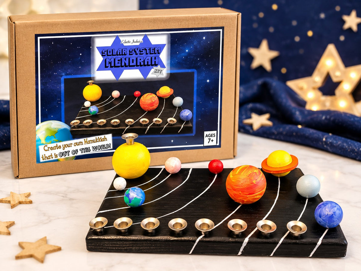 Solar system menorah in front of its box