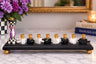 Black menorah with checkered dreidel shamash and gold cups