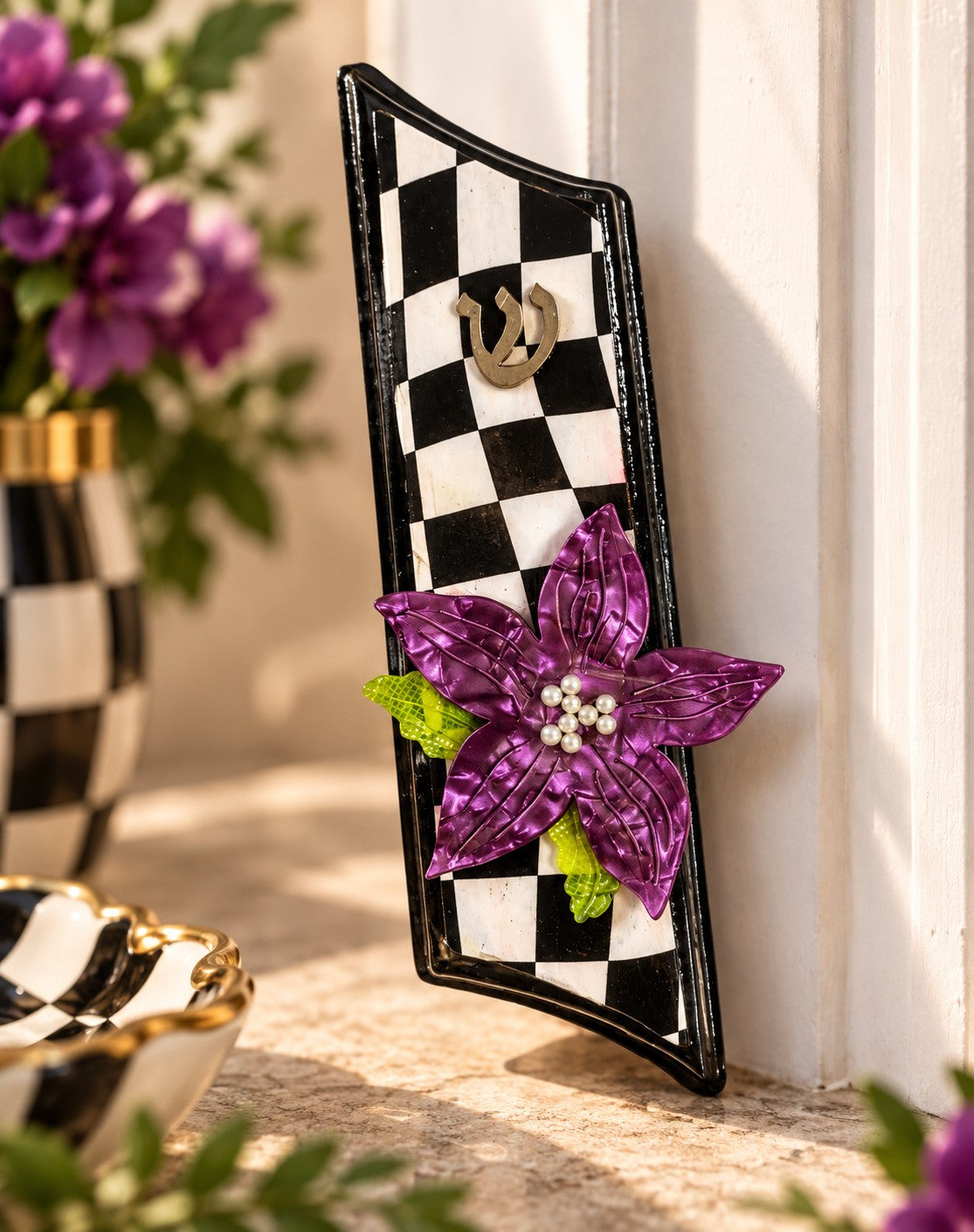 Violet Bloom Mezuzah Case, checkered mezuzah with purple flower on a doorpost