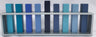 Emanuel menorah with nine square branches in shades of blue inside an open rectangular silver frame
