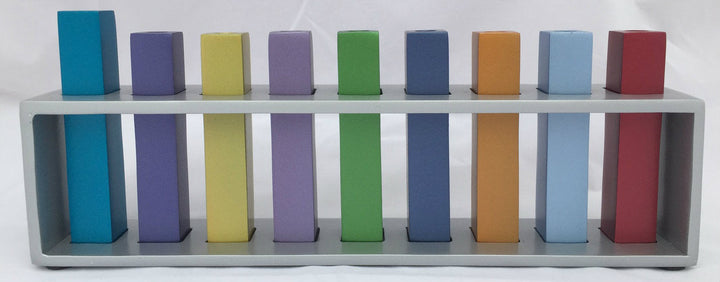 Emanuel menorah with nine multicolor square branches standing inside an open rectangular silver frame